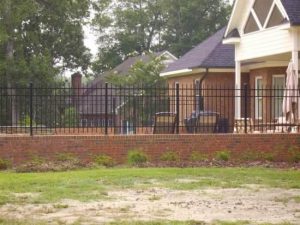 Aluminum Fence Mounted on top of Brick Wall